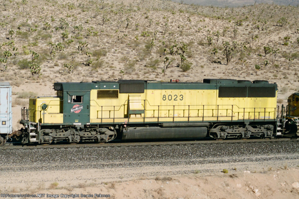 Chicago & Northwestern SD60 #8023 (with C44-9W #8632) in the consist of a westbound 